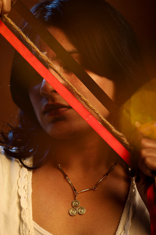 Golden Trinity Swirl Charm